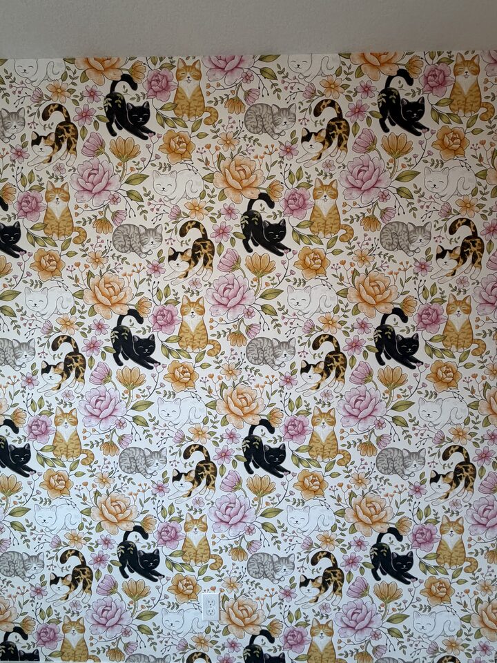 Close up of vintage cat and peony wallpaper showing seam alignment and pattern repeat, Auburn Bay Calgary installation