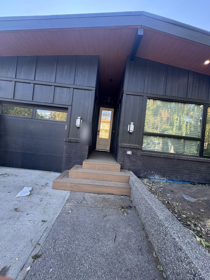 Modern dark-clad Collingwood new build with Silver Tech frosted privacy film on the front entry door glass, NW Calgary
