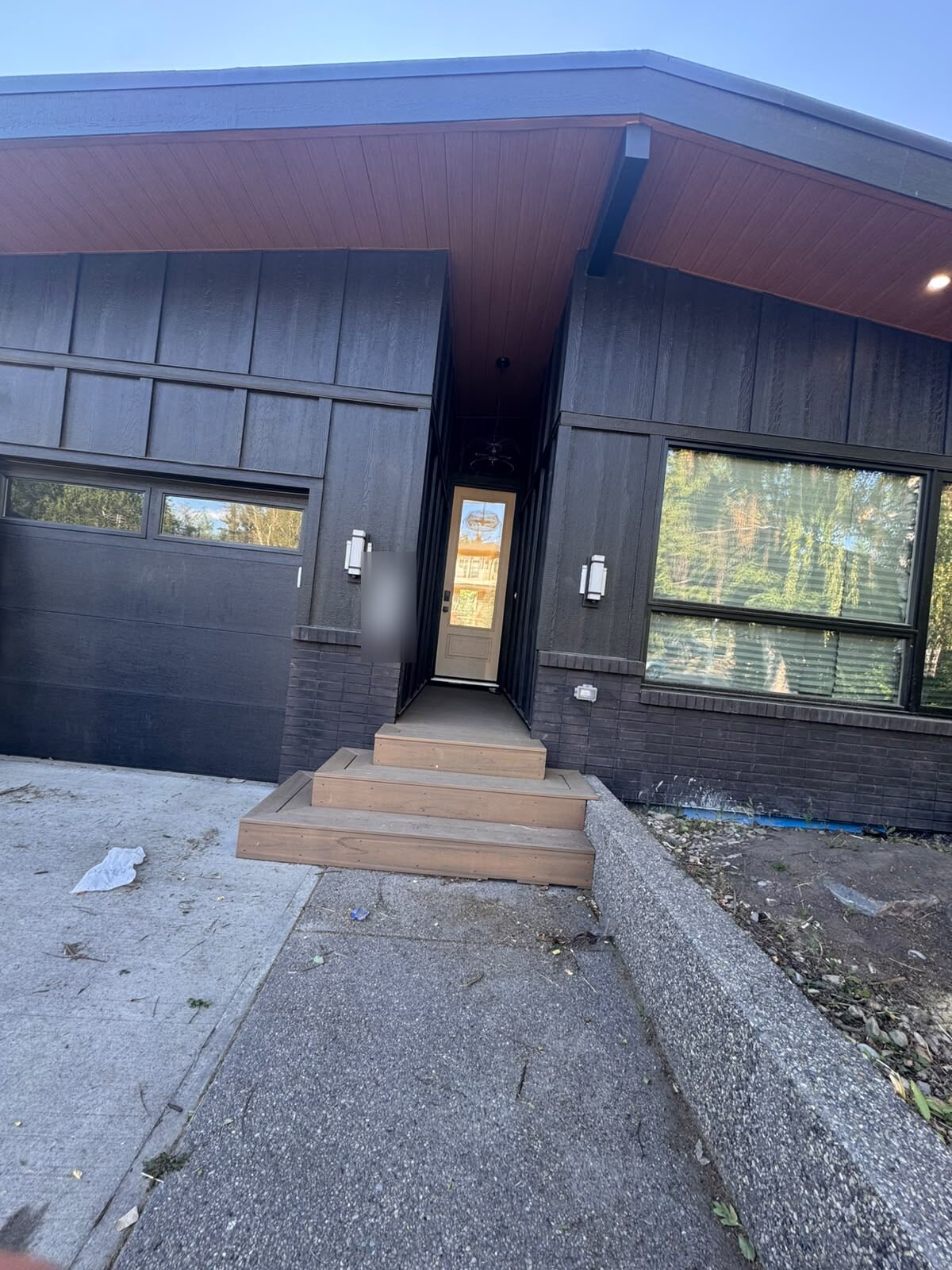 Modern dark-clad Collingwood new build with Silver Tech frosted privacy film on the front entry door glass, NW Calgary