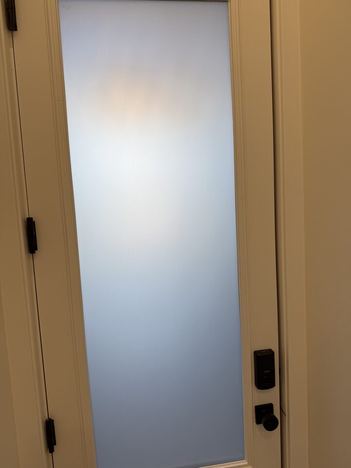 Interior view of Silver Tech frosted privacy film glowing with daylight on a Collingwood front door glass panel