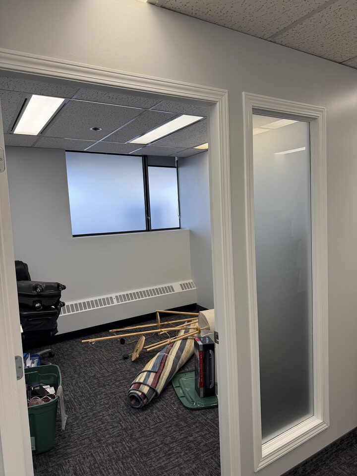 Frosted privacy film on an office window and matching door sidelite panel during suite fit-out, Centre 89, Haysboro, SW Calgary