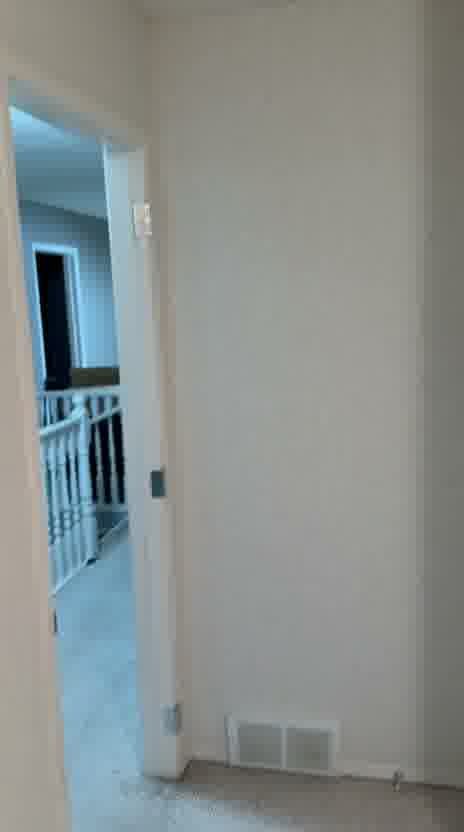 Repainted bedroom walls and doorway after full wallpaper removal in Inverness, McKenzie Towne, SE Calgary