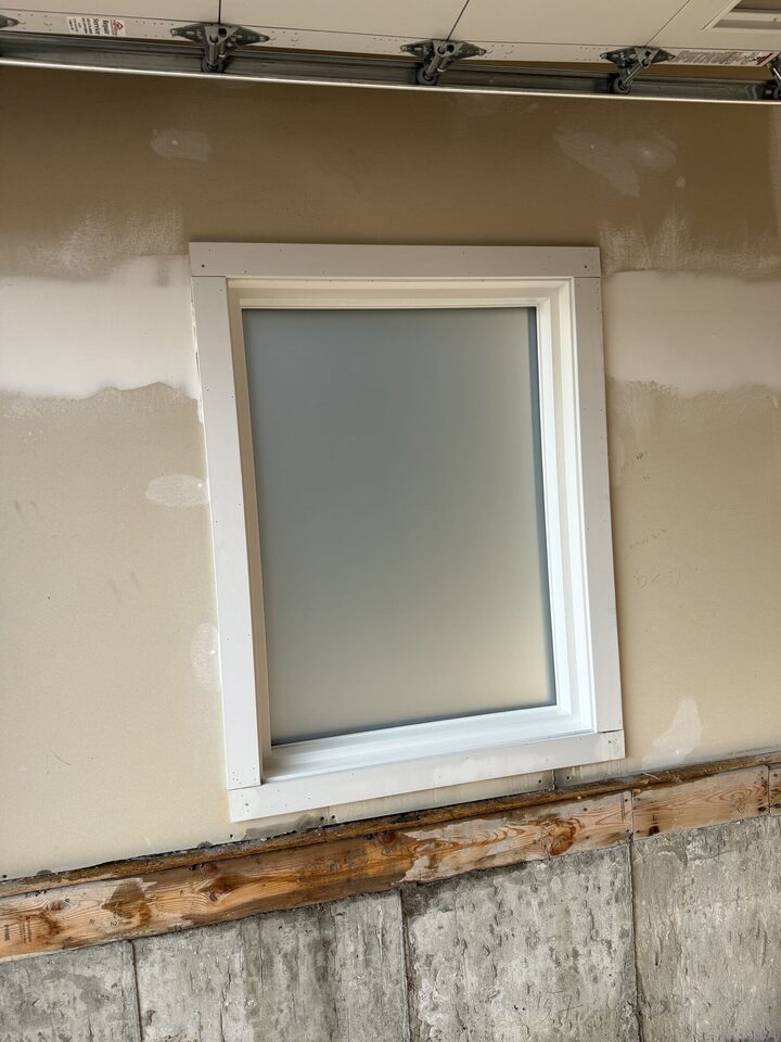 Silver Tech frosted privacy film on a garage window in Legacy, SE Calgary