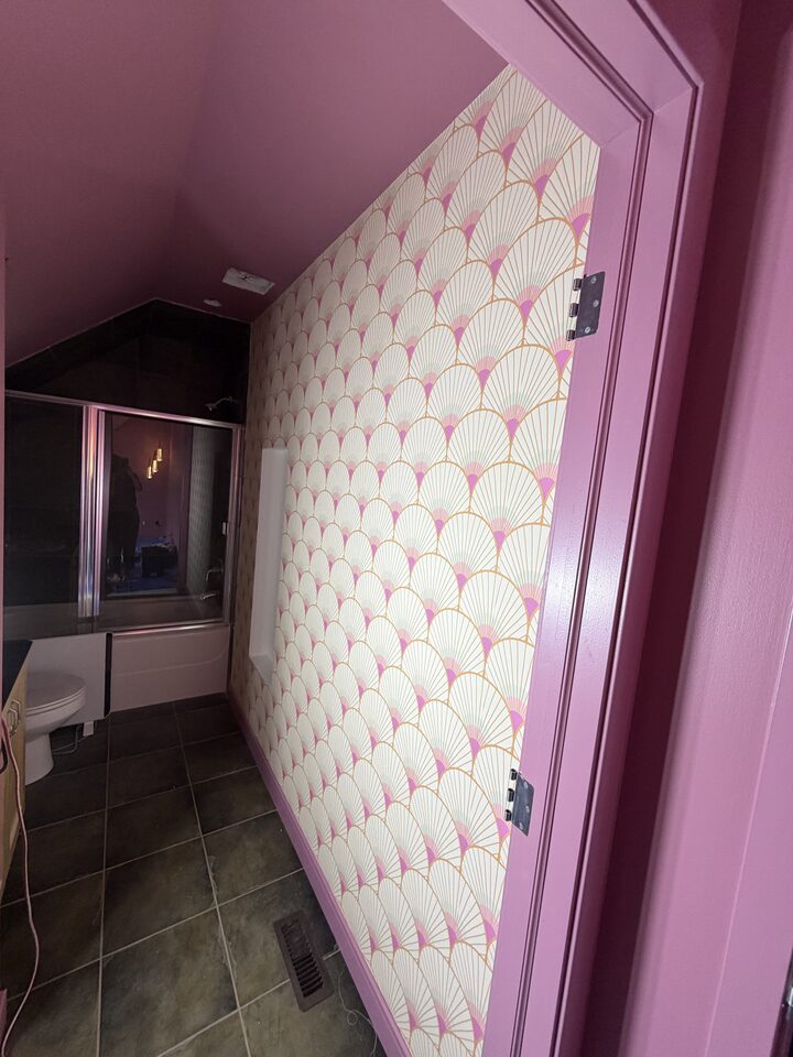 Art deco fan wallpaper on a Canmore bathroom ceiling above a shower