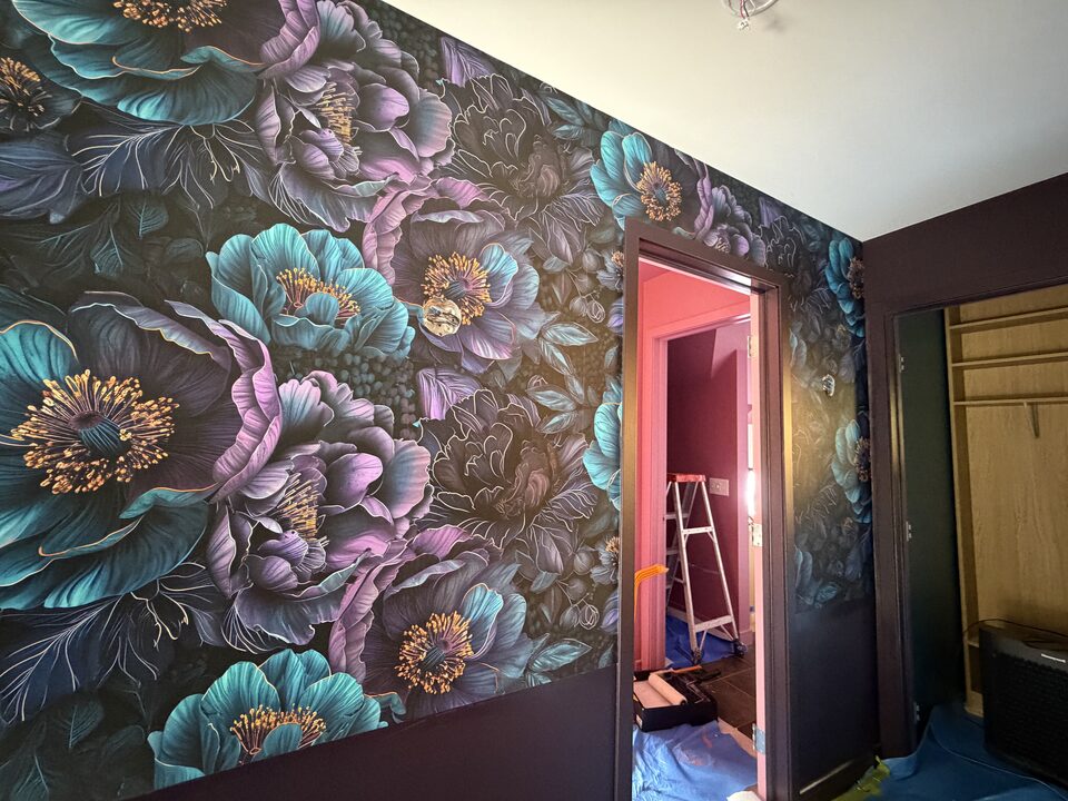Teal and violet peony mural wallpaper with gold linework in a Canmore bedroom