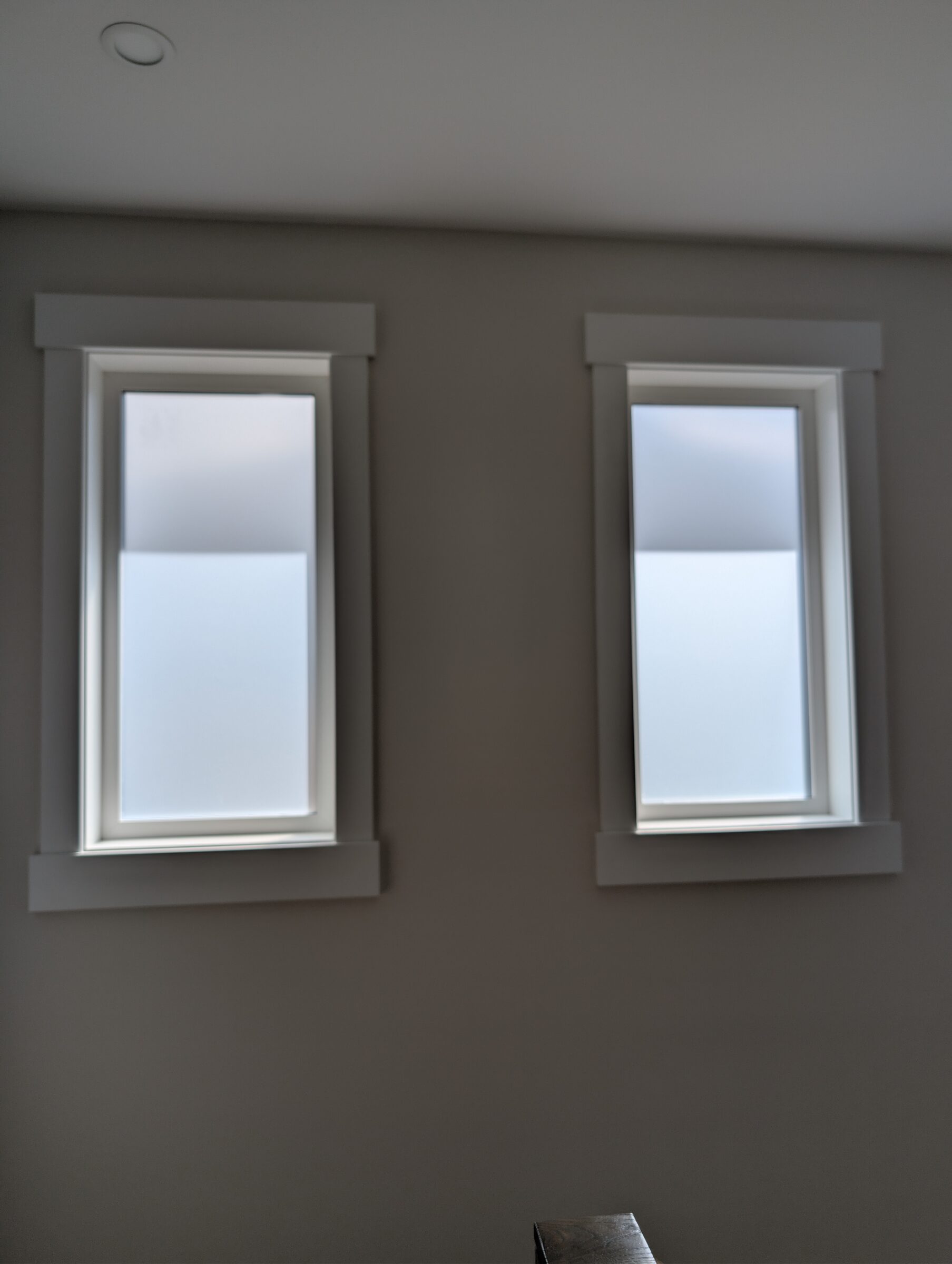 Frosted privacy window film installed on narrow dining room windows in Capitol Hill NW Calgary