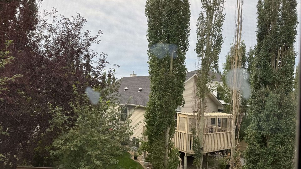 Cloudy, hazy patches seen through a window against daylight