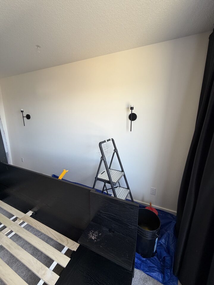 Bedroom wall before rose-gold metallic wallpaper installation in Cochrane