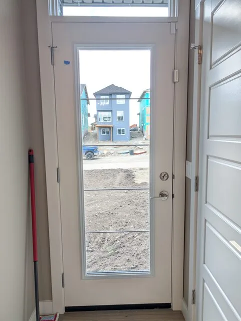 WSI's clear security-film installation on a residential entry door in Cochrane