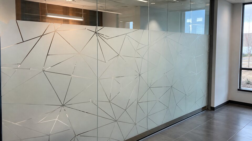 Decorative patterned film installed on interior glass