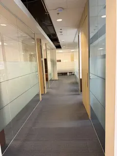 Frosted privacy film installed on office fronts and meeting-room partitions in Downtown Calgary. See full-panel frosting beneath the clear t
