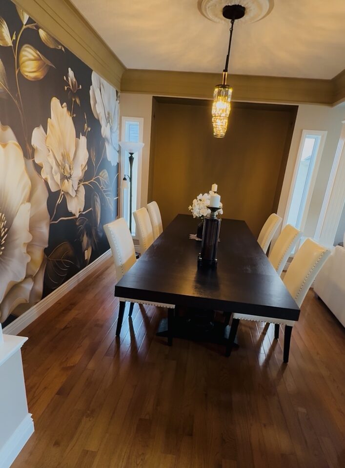 Evergreen, Calgary dining room after installation, the oversized floral mural running the length of the wall beside the dining table