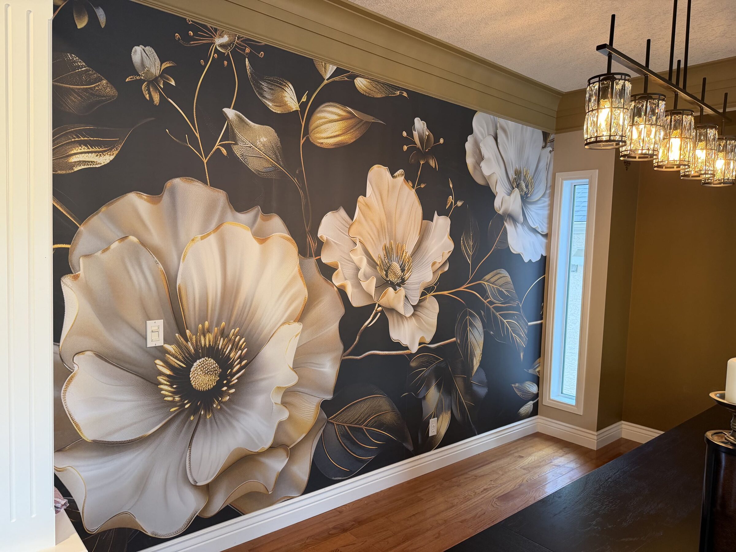 Custom-printed black, cream and gold floral mural wallpaper covering a 12 by 14 ft dining room wall in Evergreen, Calgary