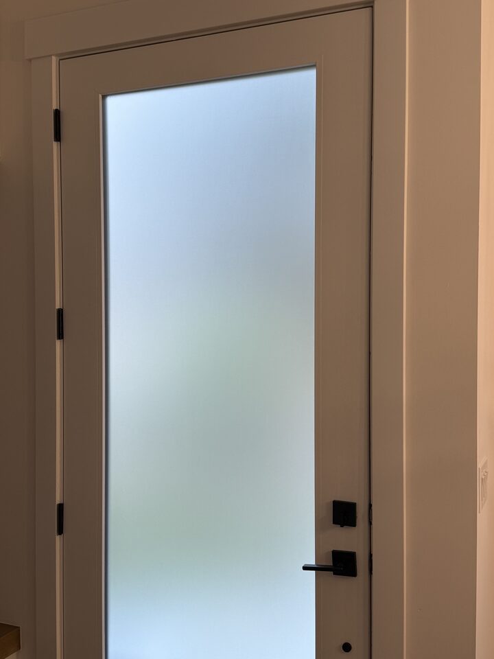 Dusted Crystal frosted privacy film on full-lite entry door glass, finished edge to edge, in a Glenbrook SW Calgary home