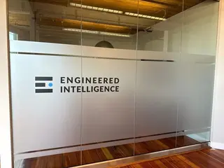 Case study for branded frosted privacy film on interior office meeting room glass in Inglewood SE Calgary, with process photos and video.