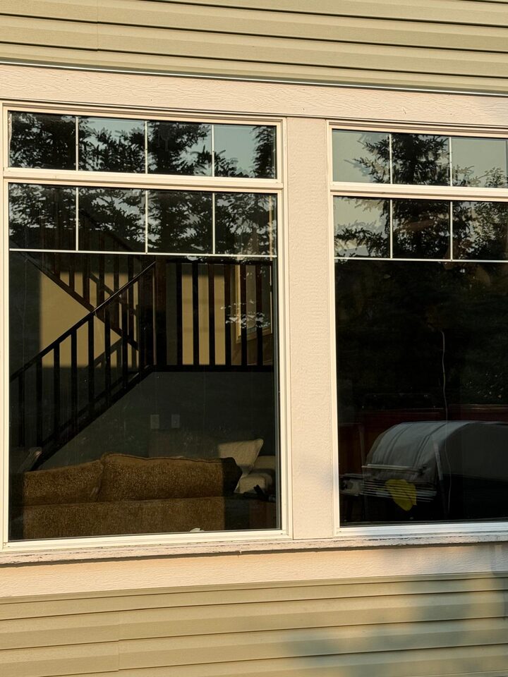 Exterior view of XPEL Night Vision 37 solar window film showing a neutral low-reflectivity tint on a Silverado SW Calgary home