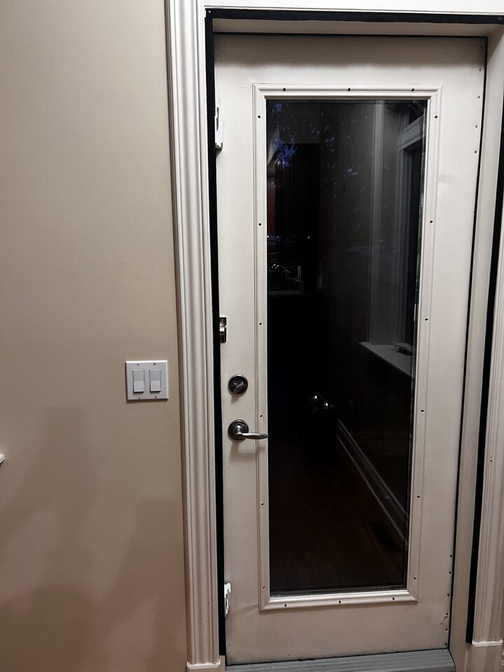 Full-lite back entry door glass protected with clear safety and security window film in South Calgary, SW Calgary