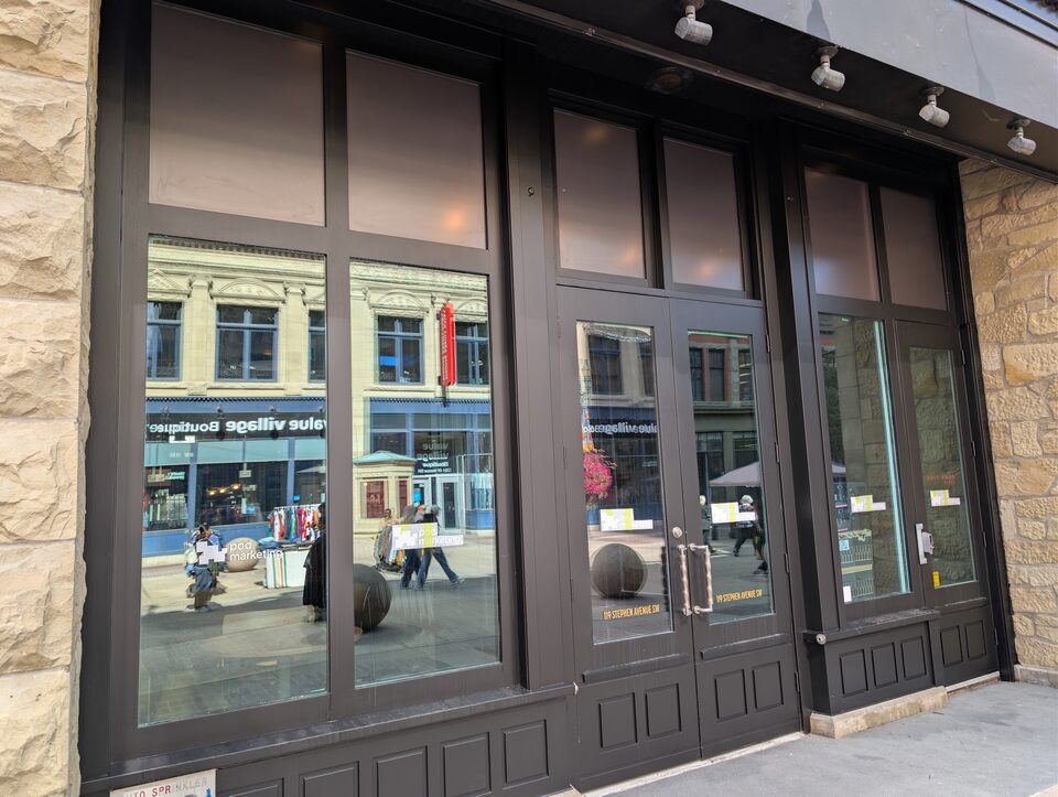 Oblique exterior view of the glazed entrance on the Downtown Calgary solar-film project