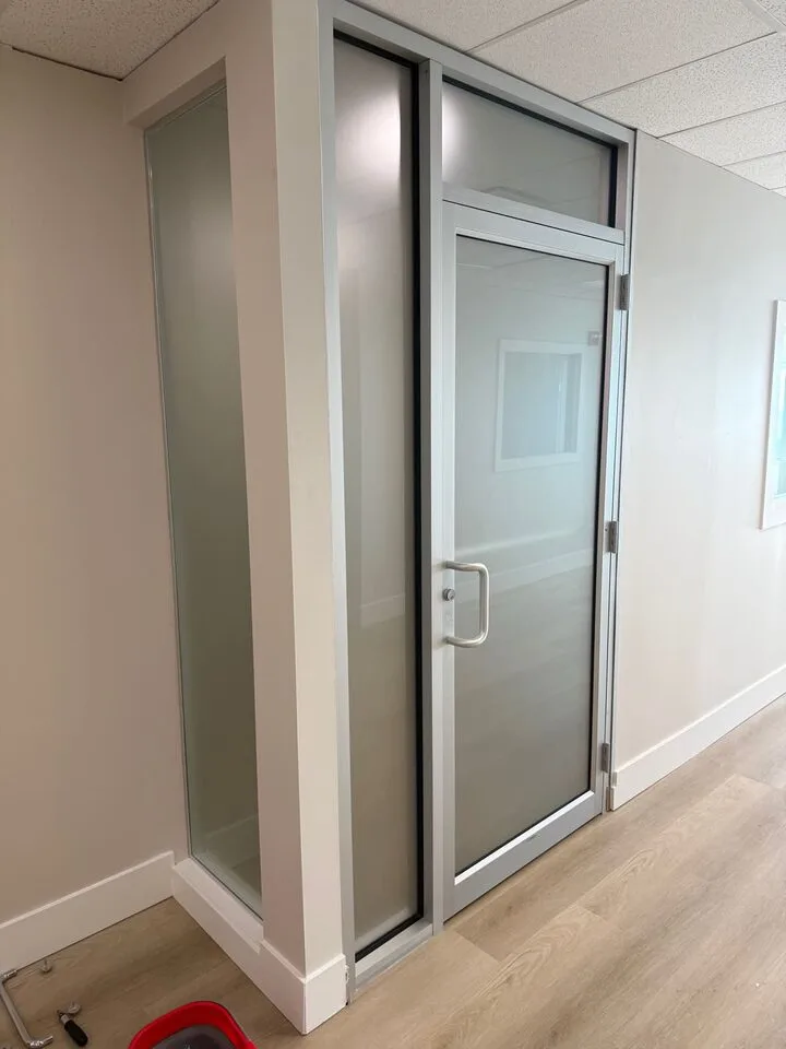 Frosted office glass privacy film on doors and sidelites in Calgary