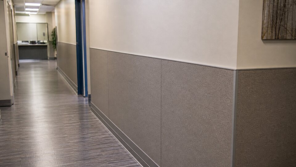 Installed wall protection in a high-traffic corridor