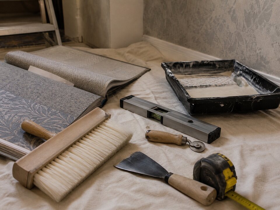 Installer tools and materials used for detailed wall finish work